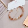 Bracciale pietre terracotta e perla
